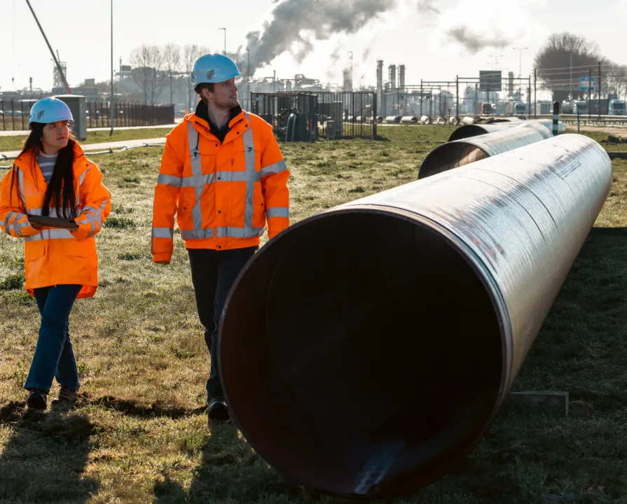Pipeline operators on a field inspection.