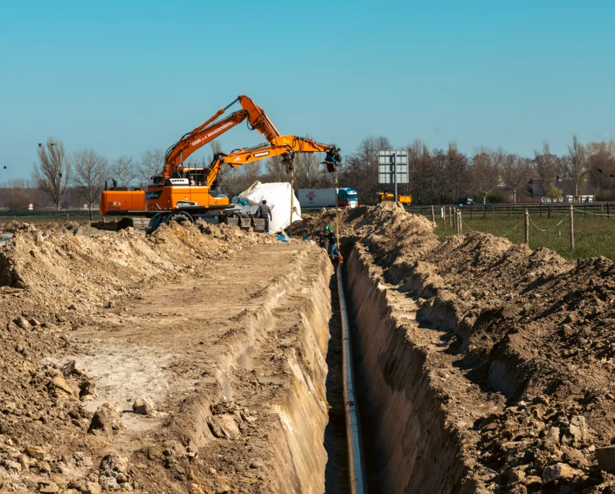 Excavator near the pipeline.